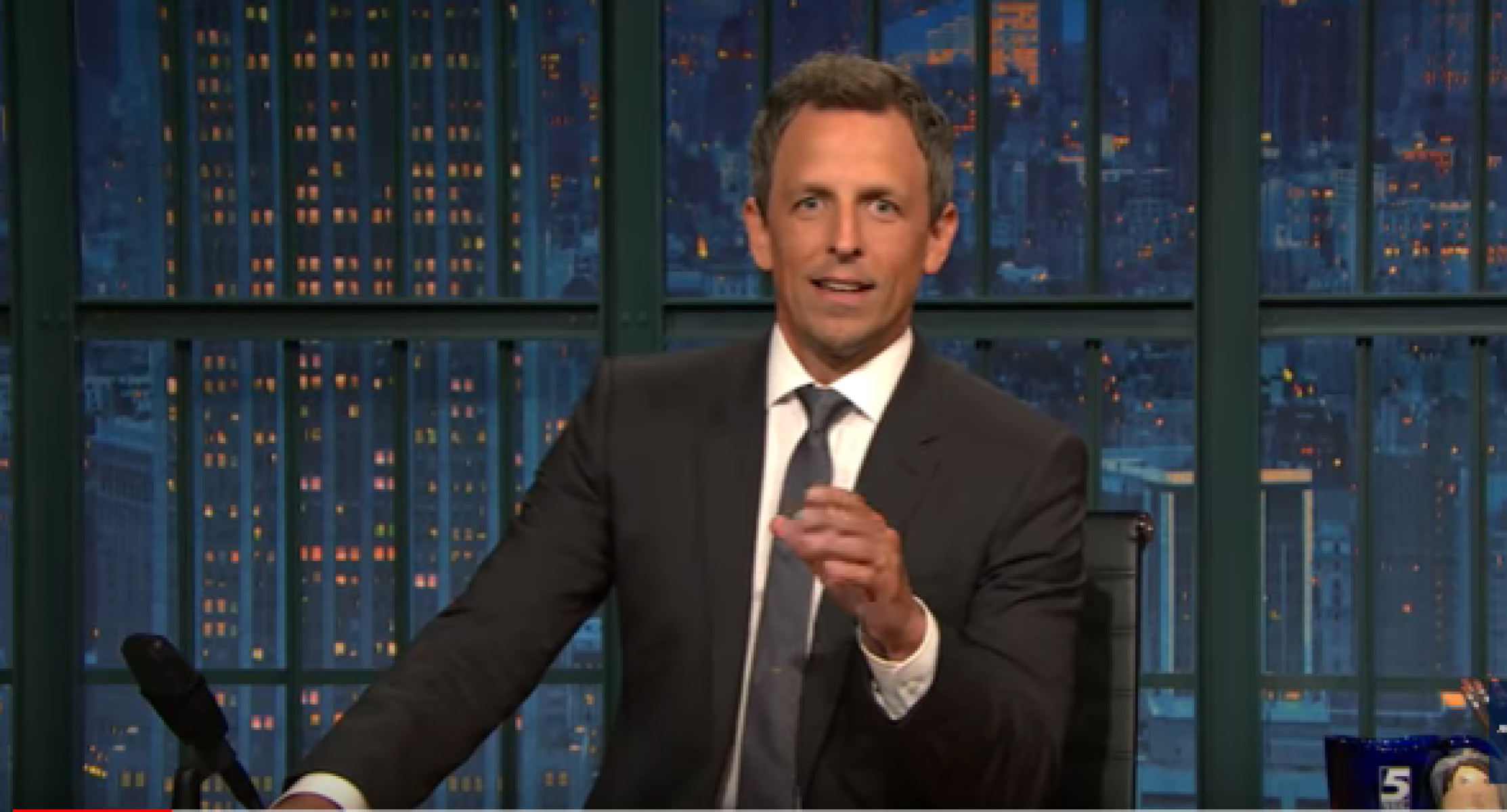 Seth Meyers at his "Late Night" desk
